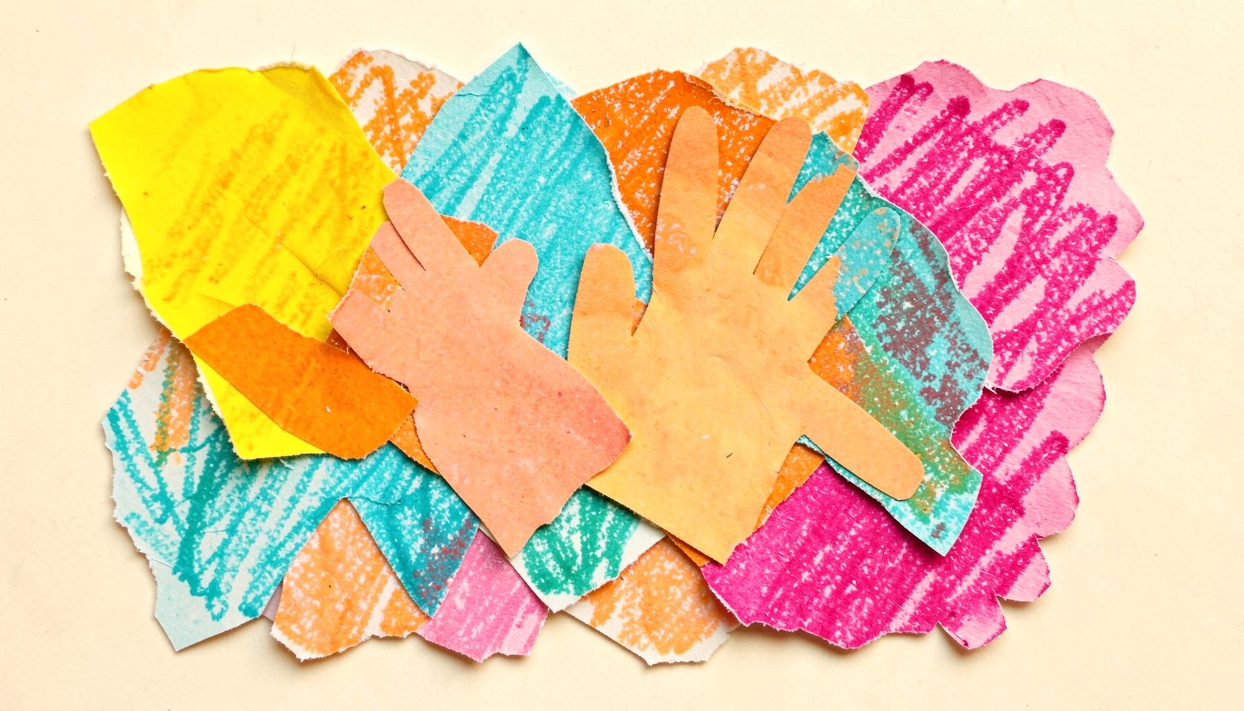 A layered paper cut-out collage of a child's hands surrounded by bright torn-paper shapes in yellow, orange, turquoise, and magenta, with crayon-like scribble textures and a warm cream background