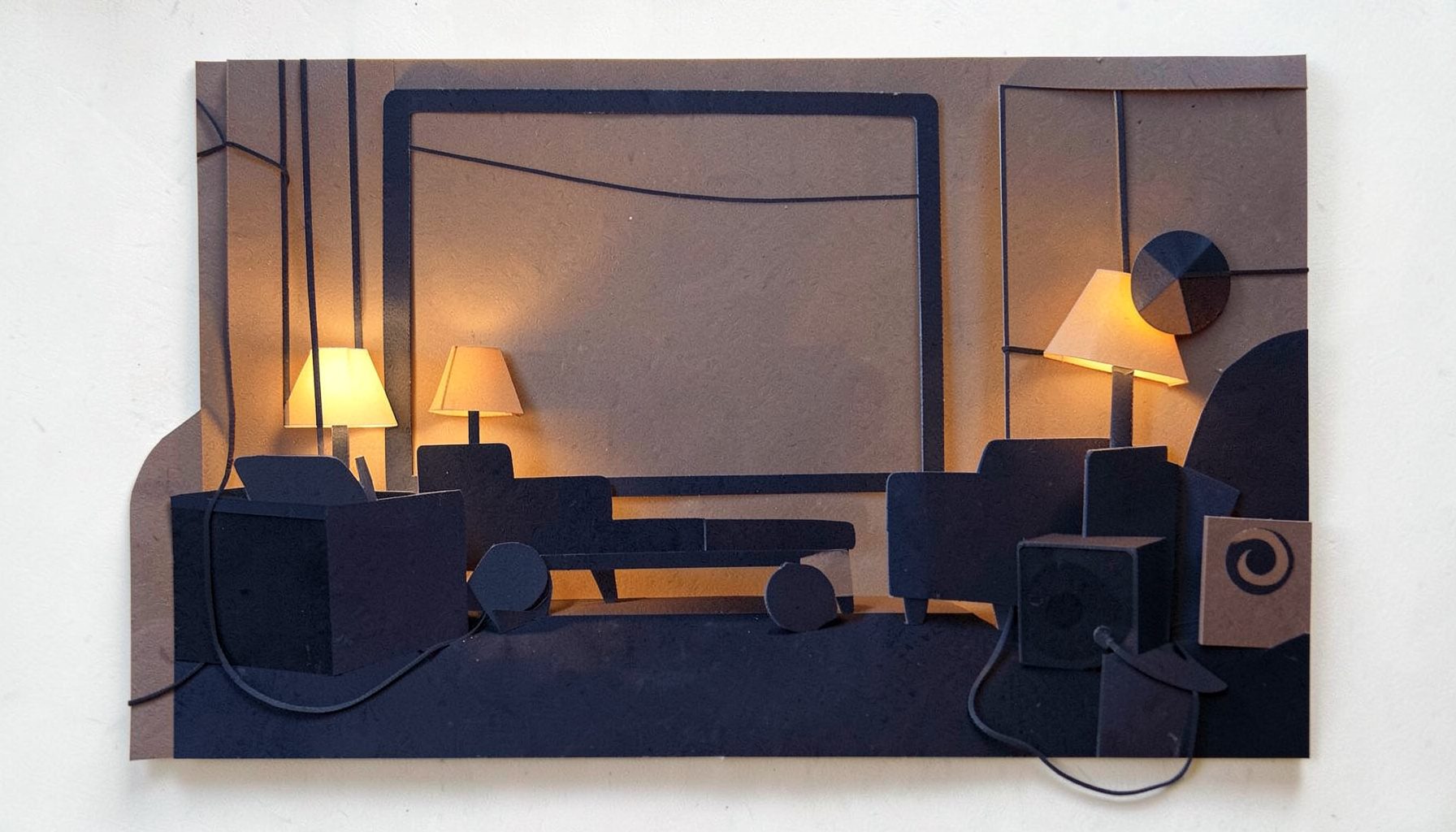 A layered paper cut-out collage of a cozy living room at dusk: warm amber and deep navy tones, silhouettes of a large screen, soft glowing lamps, and abstract geometric shapes suggesting speakers and cables.